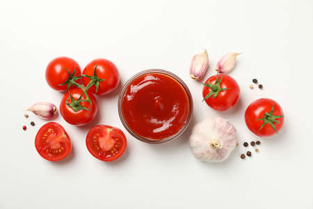Tomatoes, sauce and ingredients on white background, top viewの写真素材