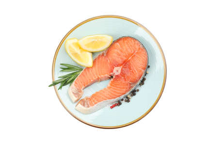 Plate with salmon meat and spices isolated on white backgroundの写真素材