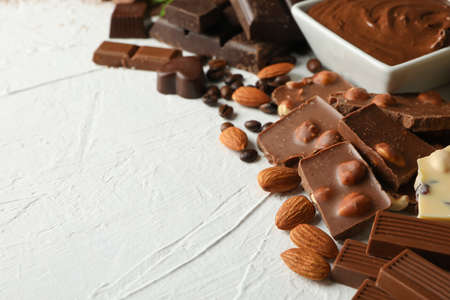 Chocolate, melted chocolate, coffee and almond on white backgroundの写真素材