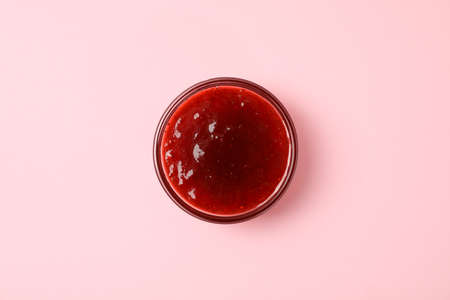 Delicious strawberry jam on pink background, top viewの写真素材