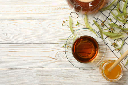 Composition with linden tea on wooden background, top view. Natural teaの写真素材