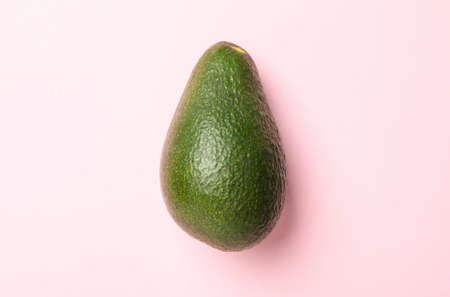 Ripe fresh avocado on pink background, close upの写真素材