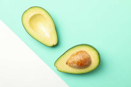 Ripe fresh avocado on two tone background, top viewの写真素材