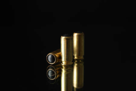 Rubber bullets on mirror background. Self defense weaponの写真素材