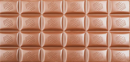 Different chocolate bars on whole background. Sweet food