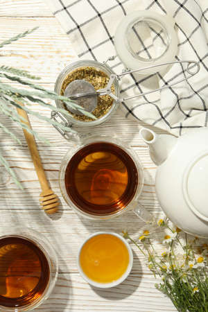 Composition with chamomile tea on white wooden backgroundの写真素材