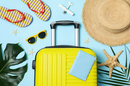 Travel accessories on blue background, top view. Travel bloggerの写真素材