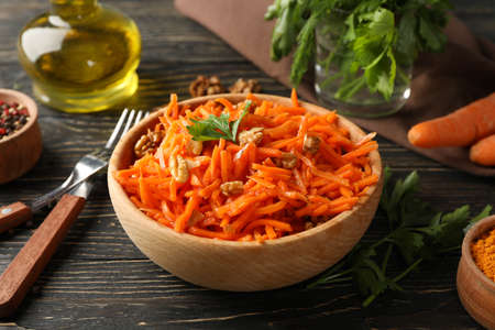 Composition with tasty carrot salad on wooden background. Korean carrotの写真素材