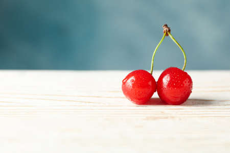 Fresh red cherry on wooden background, close upの写真素材