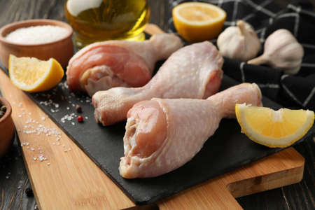 Composition with raw chicken meat on wooden background, close upの写真素材