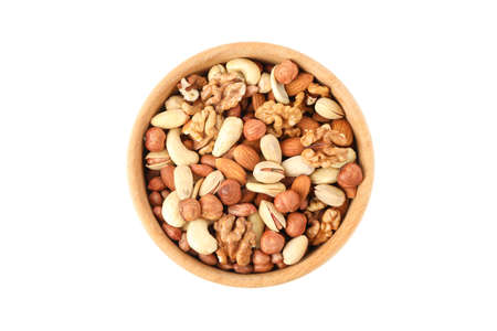 Bowl with different nuts isolated on white background. Vitamin foodの写真素材