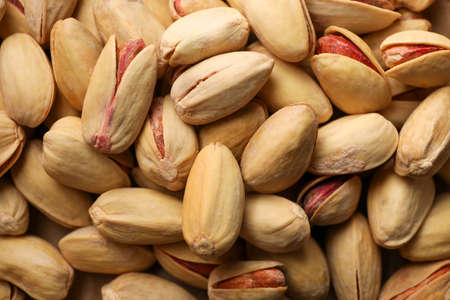 Tasty peanut on whole background, close up. Vitamin food