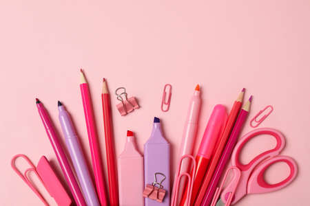 Pink pencil case with different supplies on pink backgroundの写真素材