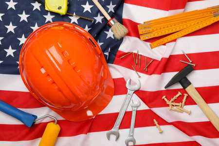 Construction tools on american flag background, space for textの写真素材