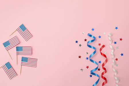 American flags, curly ribbons and stars on pink backgroundの写真素材