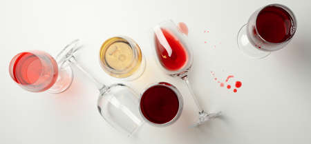 Glasses of wine on white background, top viewの写真素材