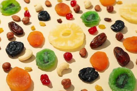 Tasty dried fruits on beige background, close upの写真素材