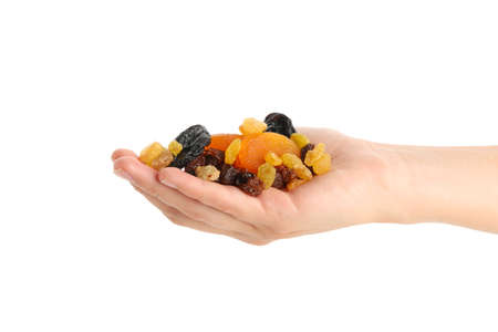 Female hand hold dried fruits, isolated on white backgroundの写真素材