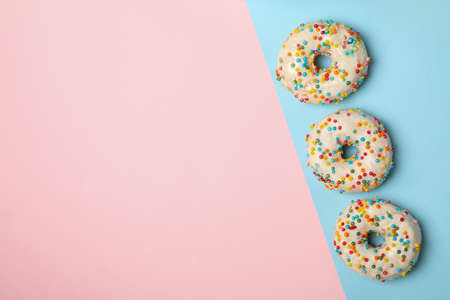 Tasty donuts on two tone background, top viewの写真素材