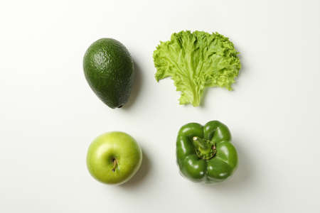 Avocado, apple, salad and pepper on white backgroundの写真素材
