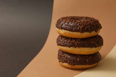 Tasty chocolate donuts on three tone backgroundの写真素材