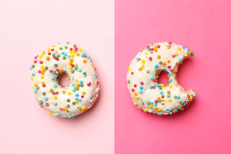 Two tasty donuts on two tone backgroundの写真素材