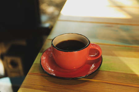 Cup of coffee on wooden table, space for textの写真素材