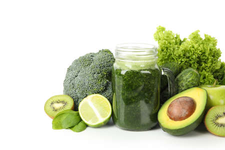 Green vegetables, fruits and jar of smoothie isolated on white backgroundの写真素材