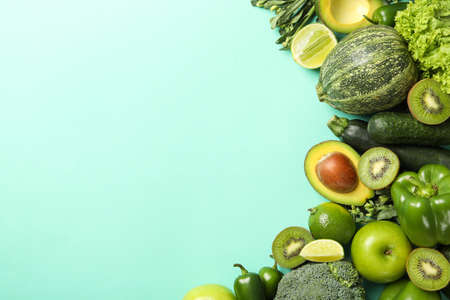 Green vegetables and fruits on mint backgroundの写真素材