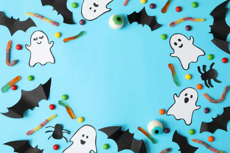 Different halloween accessories on blue background, top viewの写真素材
