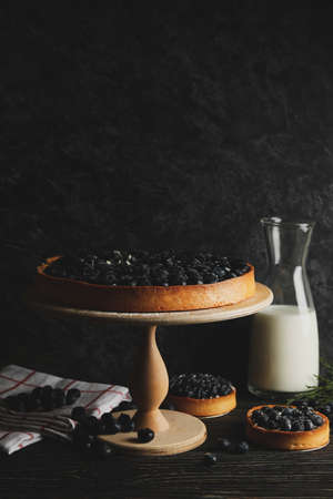 Concept of tasty lunch with blueberry pie on wooden backgroundの写真素材