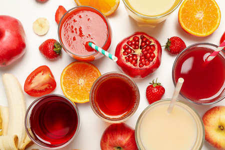 Concept of glasses with different juices on white backgroundの写真素材
