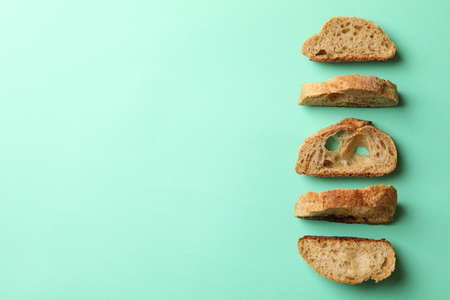 Sliced bun on mint background, top viewの写真素材
