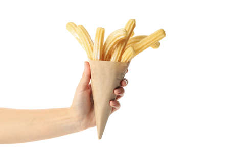 Female hand hold tasty churros, isolated on white background