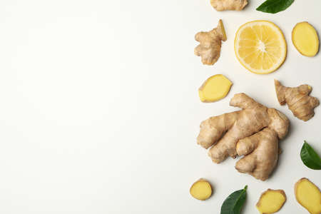 Fresh ginger and lemon on white background, top viewの写真素材