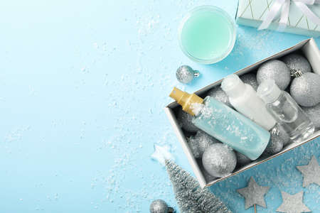 Box with winter cosmetics on blue backgroundの写真素材