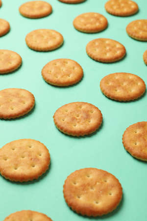 Flat lay with cracker biscuits on mint backgroundの写真素材