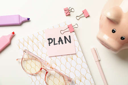 Concept of finance planning with piggy bank on white table