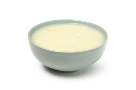 Plate with tasty mushroom soup isolated on white background