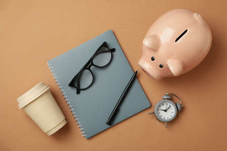 Concept of financial planning with piggy bank on craft backgroundの写真素材