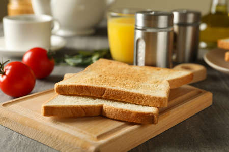 Concept of cooking toast on gray table