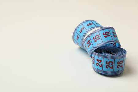 Measuring tape on white background, space for textの写真素材