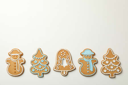 Tasty Christmas cookie on white background, space for text