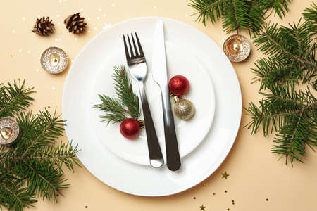 Concept of New year table setting on beige background, top view