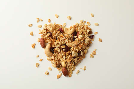 Heart made of granola on white background, top viewの写真素材