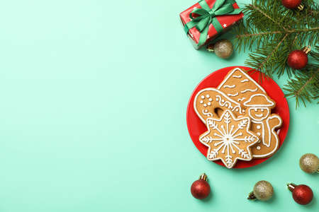Tasty Christmas cookie on mint background, space for textの写真素材