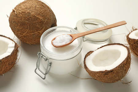 Fresh coconut and coconut milk on white background