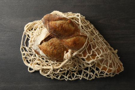 String bag with bread on black backgroundの写真素材