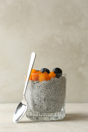 Glass with chia pudding on wooden tableの写真素材
