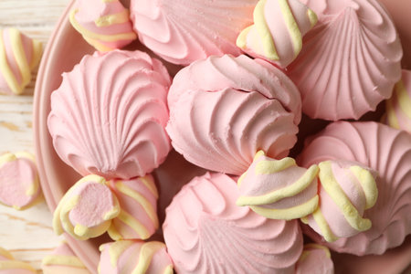 Plate with sweet marshmallow on wooden backgroundの写真素材